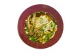 Duck noodles soup with chicken feet in brown bowl
