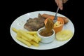 Top view of Steak with Kurobuta Pork Sausage coleslaw, french fried and pineapple, focus selective Royalty Free Stock Photo