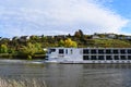 Dieblich, Germany - 10 26 2022: cruise ship passing the autumn vineyards