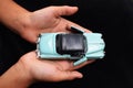 Diecast car in hands Royalty Free Stock Photo