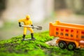 Diecast Construction Toys with Worker Shovel Lift Soil to Dump Truck Toys Royalty Free Stock Photo