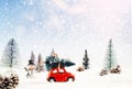 Diecast model car carries the Christmas tree in a snowy and winter cloak