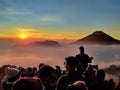 DIENG, INDONESIA JULY 4th, 2021 - People hunt sunrise and mountain view in the morning Royalty Free Stock Photo