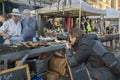 DIEPPE, FRANCE - NOVEMBER 17, 2018: A photographer photographs herring sellers. Fair Herring and scallop shell on the market