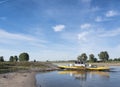 Yellow ferry on river ijssel between olburgen and dieren in gelderland