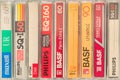 Retro styled image of a row of different vintage audio compact cassettes Royalty Free Stock Photo