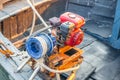 A diesel engine with a rope for raising and lowering a ship`s anchor on the deck of a fishing boat Royalty Free Stock Photo