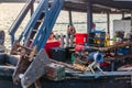 A diesel engine with a rope for raising and lowering a ship`s anchor on the deck of a fishing boat Royalty Free Stock Photo