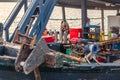 A diesel engine with a rope for raising and lowering a ship`s anchor on the deck of a fishing boat Royalty Free Stock Photo