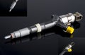 Diesel fuel injector isolated on black Royalty Free Stock Photo