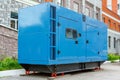 Diesel generator for emergency power supply at the wall of the medical center in good weather
