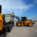 Diesel loader will load construction crushed stone. Royalty Free Stock Photo