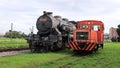 The diesel locomotive overtaking the steam locomotive symbolizes the evolution of the times and the progress of scienc.