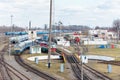 Diesel locomotives and carriages stand in depot near railway turntable