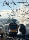 Diesel multiple unit and vintage steam train Royalty Free Stock Photo