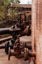 Diesel oil storage tank in an industrial plant. Open and closed valves.