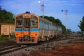 Diesel railcar leaves the station. Royalty Free Stock Photo