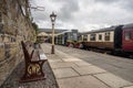 Diesel railcar waits by a platform Royalty Free Stock Photo