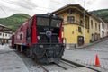 A diesel train engine sits at the Alausi station in Ecuador.