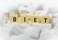 Diet block letters word on pile of sugar cubes close up in dieting concept Royalty Free Stock Photo