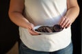 Diet breakdown. overweight woman eating sweets