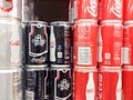 Diet Coke zero classic coca cola cans cases stacked in supermarket background