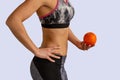 Diet concept. Beautiful young healthy fit slim woman in training clothes Royalty Free Stock Photo