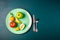 Diet concept. Composition of healthy food on a plate and cutlery. Flat lay, green blue background, space for text. AI generated