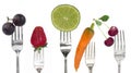 Diet concept with fruit and vegetables on the forks