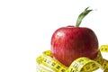 Diet concept - Red apple and measure tape Royalty Free Stock Photo