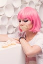 The diet concept. sad girl with taped mouth looking to sweets Royalty Free Stock Photo