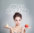 Diet Concept. Sad Woman with Healthy and Unhealthy Food. Royalty Free Stock Photo