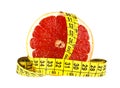 Diet concept: slice of grapefruit and measuring tape on white background