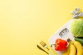 Diet concept. Top view photo of vegetables and fruits cabbage avocado bell pepper bananas cutlery tape measure and scales on Royalty Free Stock Photo