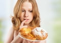 Diet concept. woman on a diet dreaming of buns Royalty Free Stock Photo