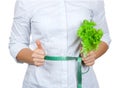 Diet Concept. Young Woman with Lettuce Measuring Her Waistline w Royalty Free Stock Photo