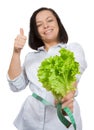 Diet Concept. Young Woman with Lettuce Measuring Her Waistline w Royalty Free Stock Photo