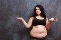 Diet, dieting concept. Beautiful young obese overweight woman wi Royalty Free Stock Photo