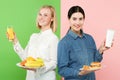 Diet. Dieting concept. Healthy Food. Beautiful Young Women choosing between fruits and unhelathy fast food Royalty Free Stock Photo