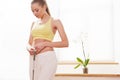 Diet. Dieting concept. Woman in Sportswear Measuring Her Waist Royalty Free Stock Photo