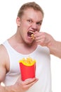 Diet failure of fat man eating french fries fast food. Portrait of overweight person who spoiled healthy meal . Junk