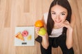 Diet And Fast Food Concept. Overweight Woman Standing On Weighing Scale Holding Pizza. Unhealthy Junk Food. Dieting, Lifestyle. We Royalty Free Stock Photo