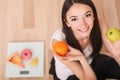 Diet And Fast Food Concept. Overweight Woman Standing On Weighing Scale Holding Pizza. Unhealthy Junk Food. Dieting, Lifestyle. We Royalty Free Stock Photo