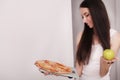 Diet And Fast Food Concept. Overweight Woman Standing On Weighing Scale Holding Pizza. Unhealthy Junk Food. Dieting, Lifestyle. W Royalty Free Stock Photo