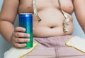 Diet. fat boy holding soft drink can. Royalty Free Stock Photo