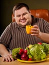 Diet fat man eating healthy food. Healthy breakfast vegetables cauliflower. Royalty Free Stock Photo