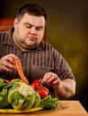 Diet fat man eating healthy food. Healthy breakfast vegetables cauliflower. Royalty Free Stock Photo