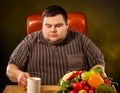 Diet fat man eating healthy food . Healthy slimming tea. Royalty Free Stock Photo