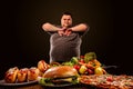Diet fat man makes choice between healthy and unhealthy food. Royalty Free Stock Photo