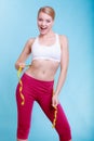 Diet. Fitness woman fit girl with measure tape measuring her waist Royalty Free Stock Photo